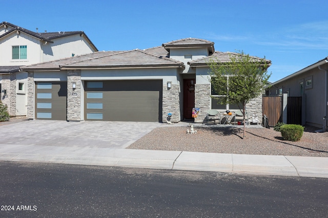 prairie-style home featuring a garage