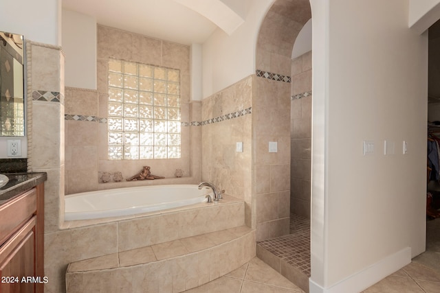 bathroom with vanity, shower with separate bathtub, and tile patterned floors