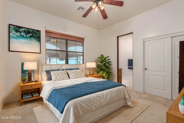 carpeted bedroom with a closet and ceiling fan