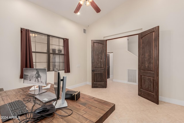 sitting room with high vaulted ceiling, ceiling fan, and light tile patterned flooring