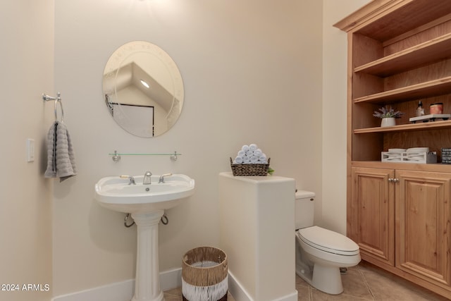 bathroom featuring tile patterned floors and toilet