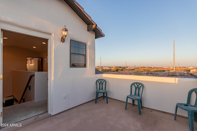 view of patio terrace at dusk