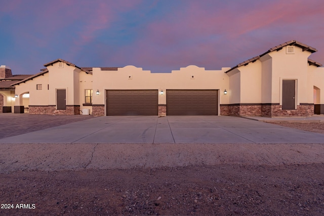 view of front of property with a garage