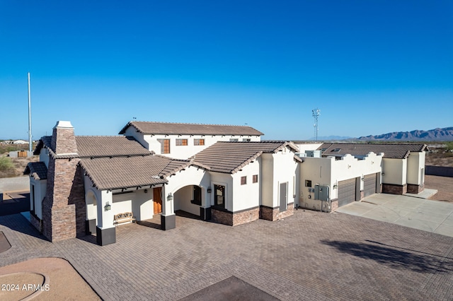 exterior space featuring a mountain view and a garage