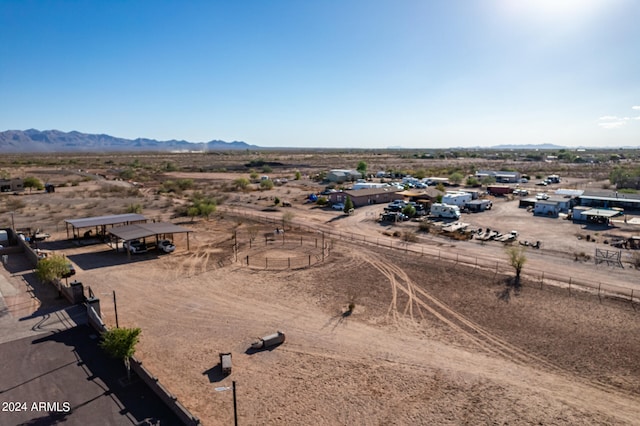 birds eye view of property featuring a mountain view