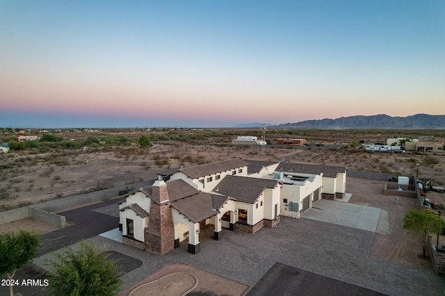 aerial view at dusk with a mountain view