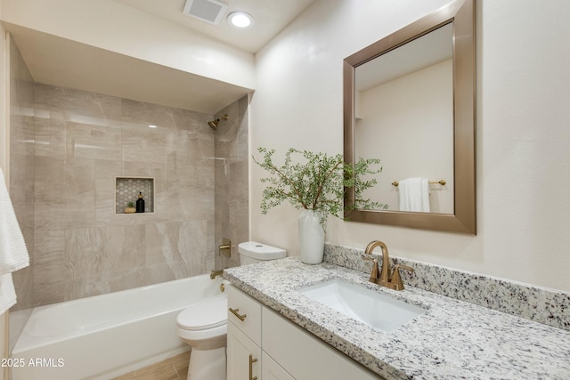 full bathroom featuring visible vents, tub / shower combination, toilet, and vanity