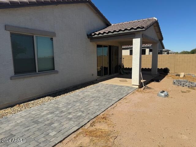 back of property with a patio area