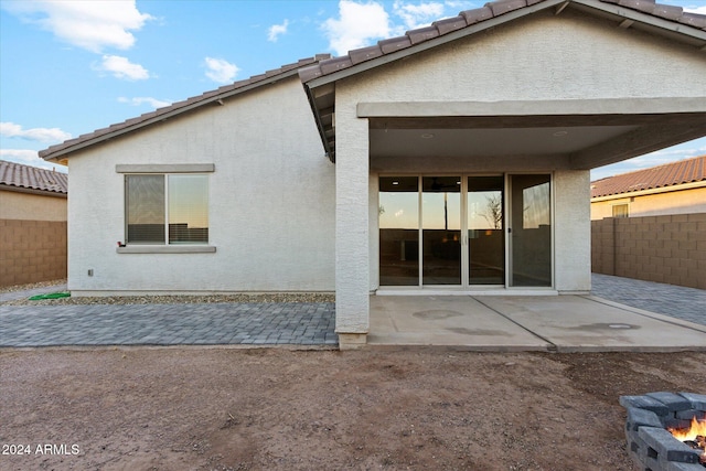 rear view of property featuring a patio area