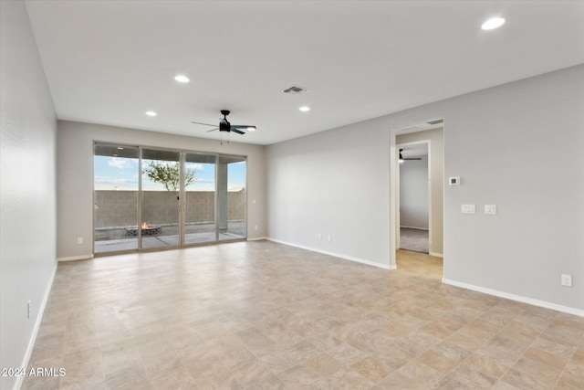 empty room featuring ceiling fan