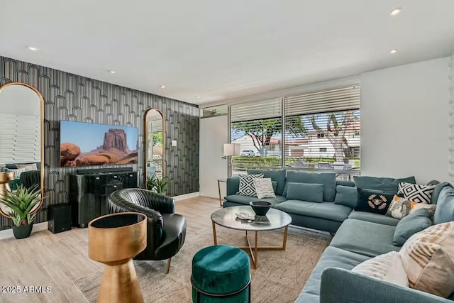 living room featuring wallpapered walls, wood finished floors, and recessed lighting