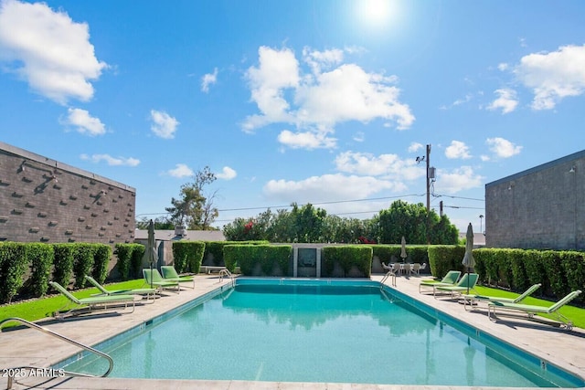 pool with a patio area