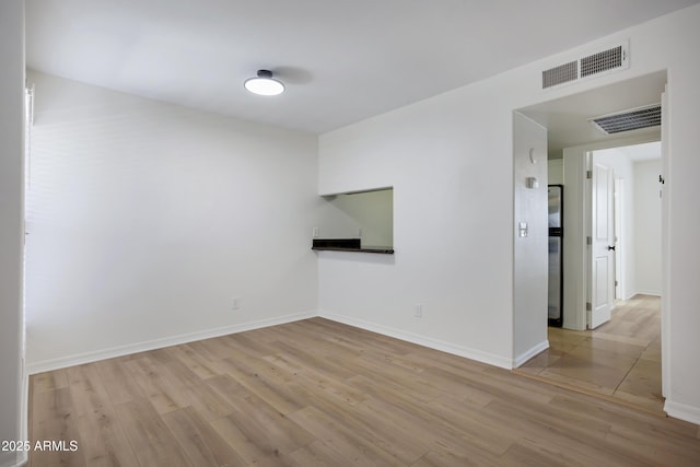 3619 E Monterosa St Unit 202, Phoenix, AZ 85018 - unfurnished room with wood finished floors and baseboards