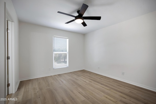3619 E Monterosa St Unit 202, Phoenix, AZ 85018 - empty room with wood finished floors and ceiling fan