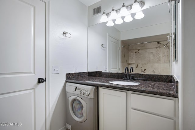 3619 E Monterosa St Unit 202, Phoenix, AZ 85018 - bathroom featuring washer / clothes dryer, vanity, and a shower