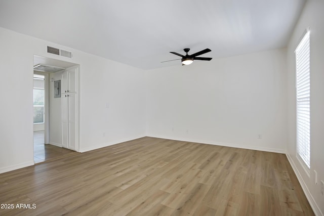 3619 E Monterosa St Unit 202, Phoenix, AZ 85018 - unfurnished room featuring light wood-style floors, plenty of natural light, and a ceiling fan