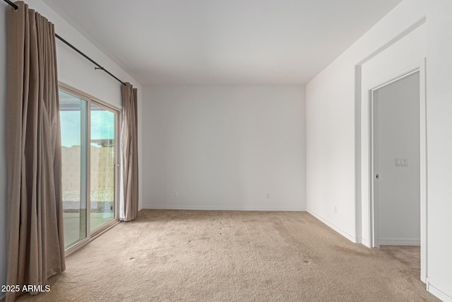 empty room featuring light colored carpet