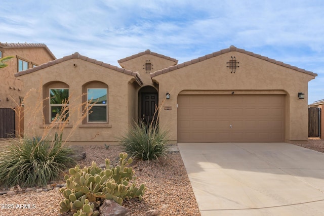 mediterranean / spanish-style home featuring a garage