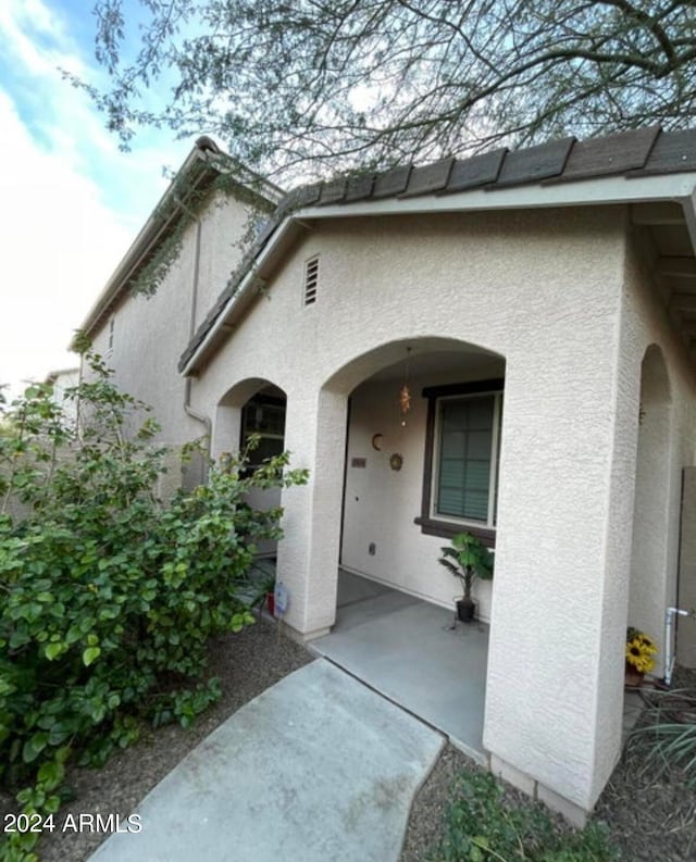 doorway to property featuring a patio