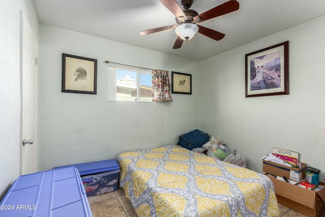 tiled bedroom with ceiling fan