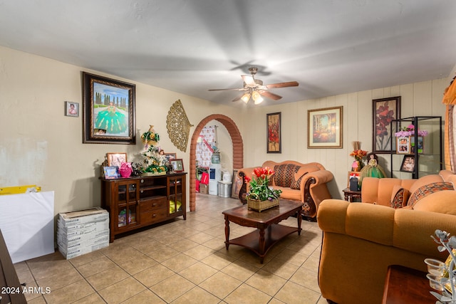 tiled living room featuring ceiling fan