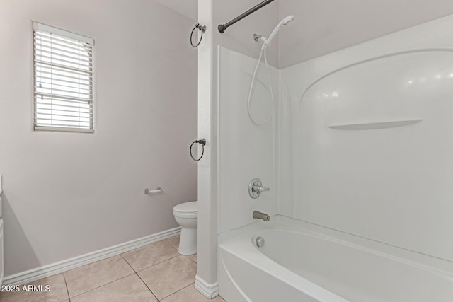 full bath with baseboards, shower / bathing tub combination, tile patterned floors, and toilet