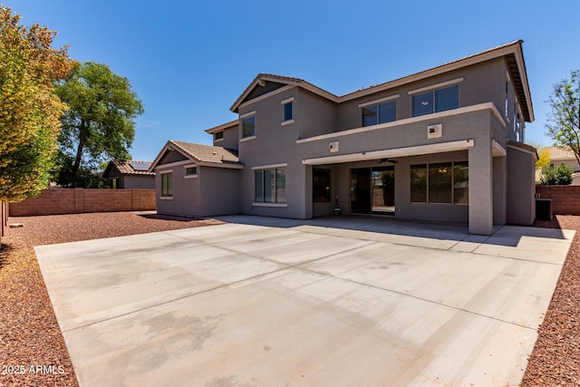 rear view of house featuring a patio, fence, a ceiling fan, and stucco siding