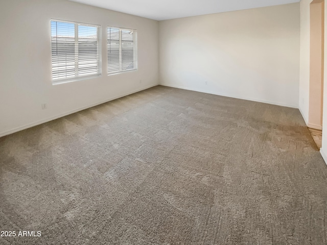 empty room with carpet flooring