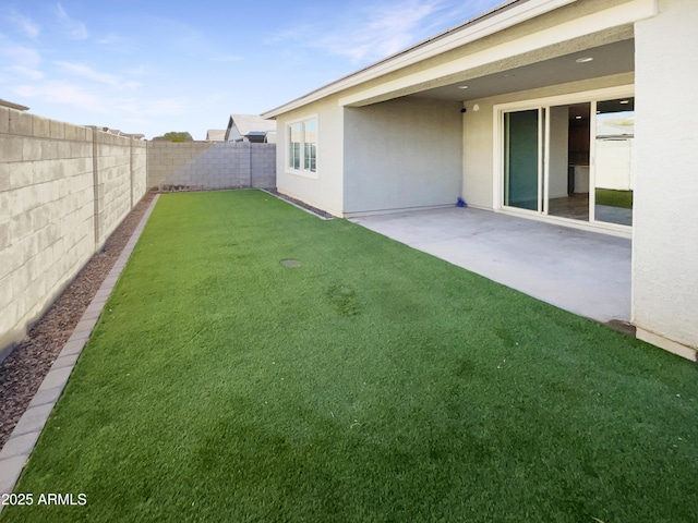 view of yard featuring a patio and a fenced backyard