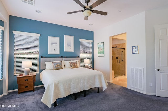 bedroom featuring multiple windows, visible vents, and dark colored carpet