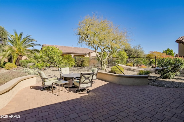 view of patio / terrace featuring fence