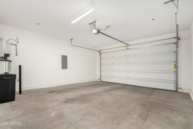 garage featuring electric panel and a garage door opener