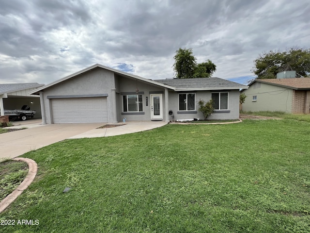 ranch-style house with a garage and a front lawn