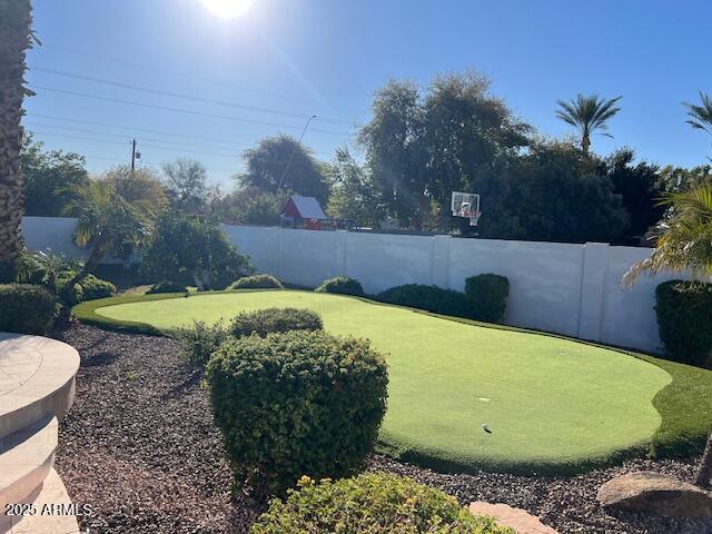 view of yard with a fenced backyard