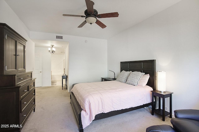 19700 N 76th St Unit 1058, Scottsdale, AZ 85255 - bedroom featuring visible vents, light colored carpet, connected bathroom, and ceiling fan with notable chandelier