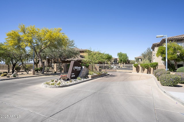 19700 N 76th St Unit 1058, Scottsdale, AZ 85255 - view of street with a gated entry and curbs