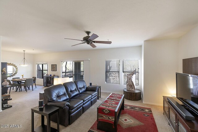 19700 N 76th St Unit 1058, Scottsdale, AZ 85255 - living area with light colored carpet, baseboards, and ceiling fan