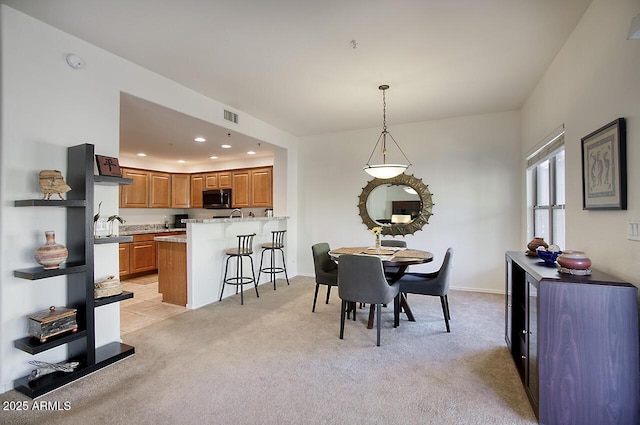 19700 N 76th St Unit 1058, Scottsdale, AZ 85255 - dining space featuring recessed lighting, visible vents, light colored carpet, and baseboards