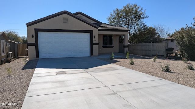 ranch-style house featuring a garage