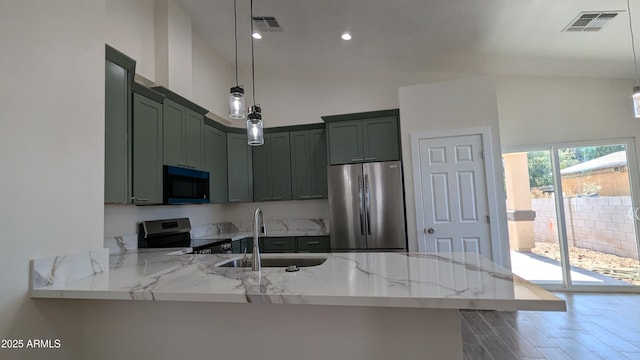 kitchen with kitchen peninsula, stainless steel appliances, decorative light fixtures, green cabinetry, and light stone countertops