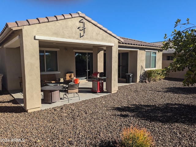 rear view of property with a patio area