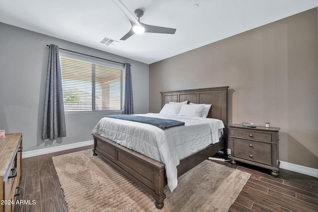 bedroom with ceiling fan and dark hardwood / wood-style flooring