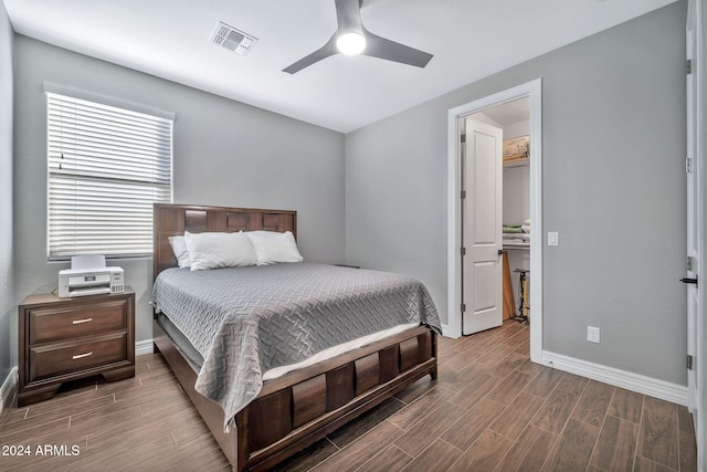 bedroom with wood-type flooring and ceiling fan