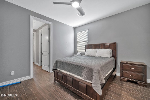 bedroom featuring dark hardwood / wood-style flooring and ceiling fan