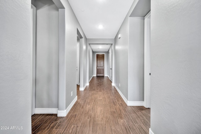 hallway featuring hardwood / wood-style floors