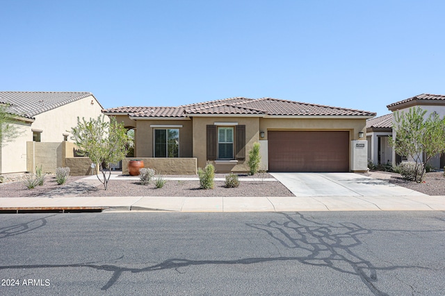 mediterranean / spanish-style home featuring a garage