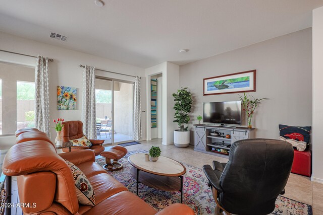 living room featuring a healthy amount of sunlight and light tile patterned floors