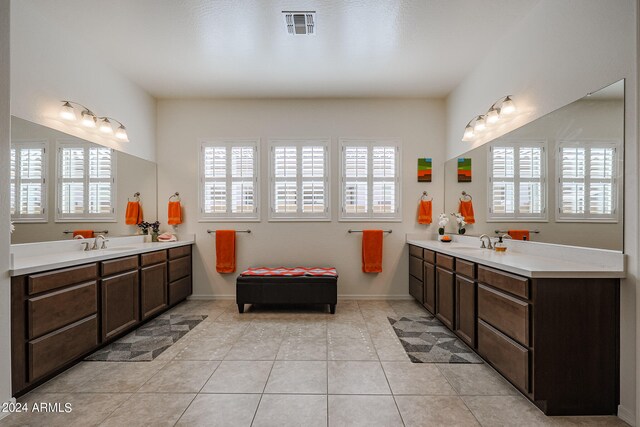 bathroom featuring tile patterned floors, plenty of natural light, and vanity