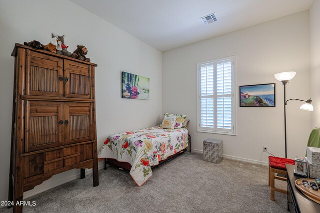 bedroom with light carpet