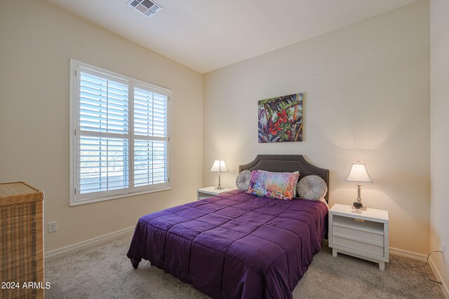 bedroom with light carpet